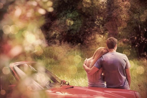 loving-virgo-man-and-sagittarius-woman-admiring-nature-while-leaning-on-their-cabriolet-on-a-sunny-day