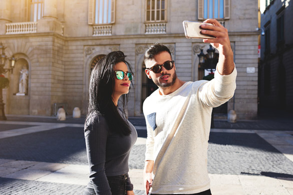 Stylish girl and her handsome friend doing selfie - why women find a virgo man so sexy