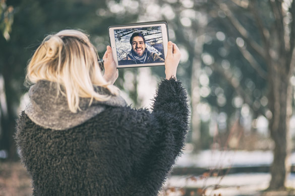 a couple talking over a video call - Is a Long Distance Relationship Possible with a Virgo Man