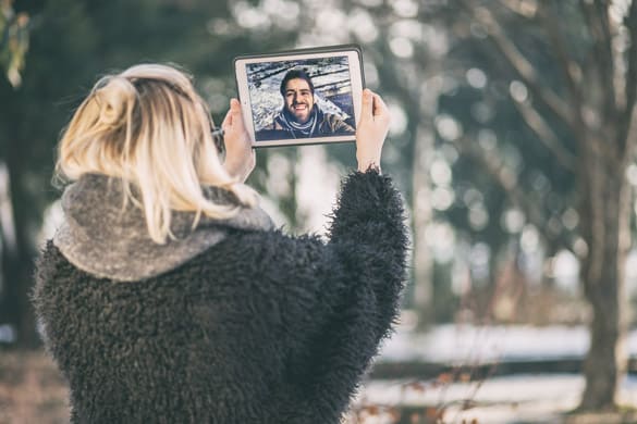 a couple talking over a video call - Is a Long Distance Relationship Possible with a Virgo Man